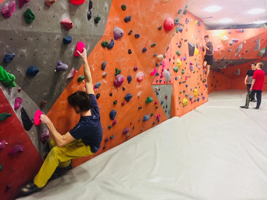 Marcin is testing new climbing wall grips fluo pink 