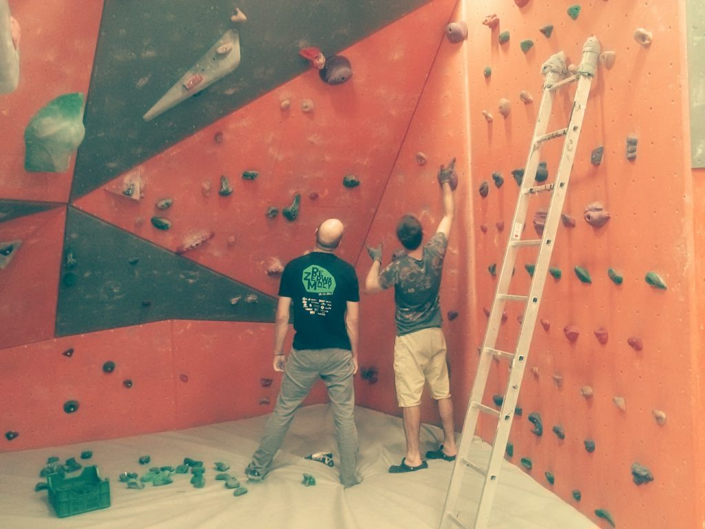 Routesetters testing new climbing holds
